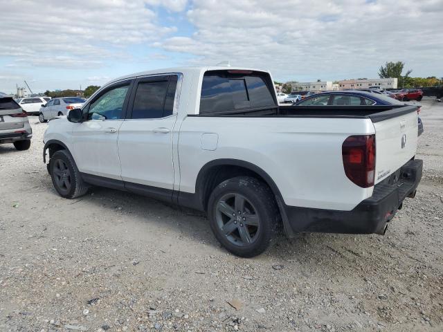 Photo 2 from auction – 2022 HONDA RIDGELINE with VIN 5FPYK3F56NB038625
