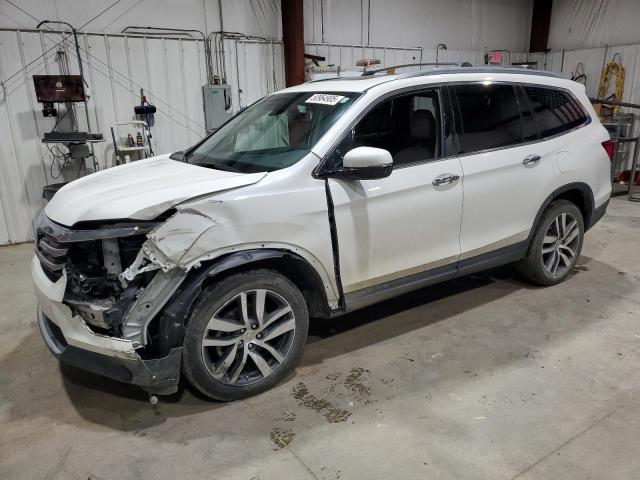 HONDA PILOT TOUR 2018 with VIN 5FNYF6H91JB019988 - Photo from auction