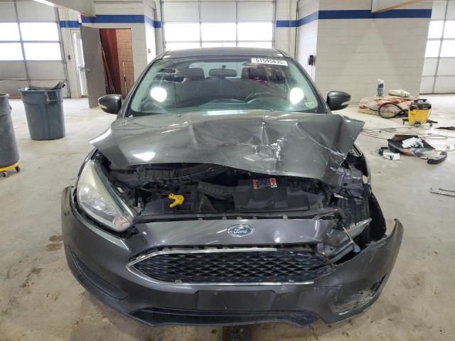 Снимка 5 от търг – 2015 FORD FOCUS SE с VIN 1FADP3K20FL253264