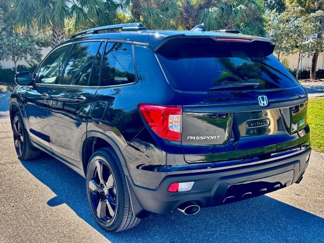 Photo 3 from auction – 2021 HONDA PASSPORT E with VIN 5FNYF8H01MB013559