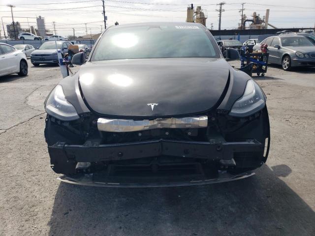 Photo 5 from auction – 2021 TESLA MODEL Y with VIN 5YJYGAEE0MF203308
