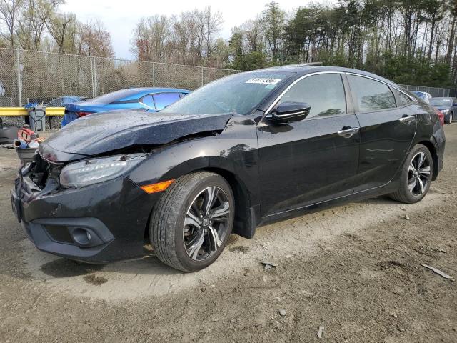 HONDA CIVIC TOUR 2017 with VIN 19XFC1F91HE030463 - Photo from auction
