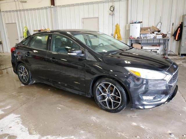 Photo 4 from auction – 2015 FORD FOCUS SE with VIN 1FADP3F23FL247954