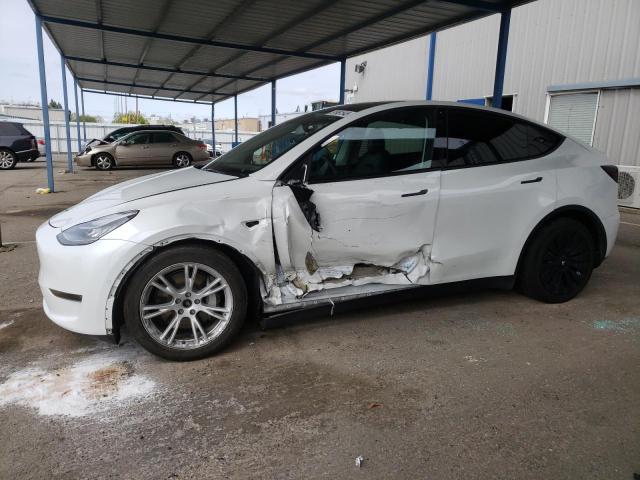 TESLA MODEL Y 2022 with VIN 7SAYGAEE9NF384400 - Photo from auction