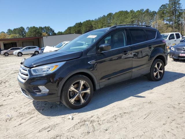 FORD ESCAPE 2018 with VIN 1FMCU9HD3JUB50185 - Photo from auction