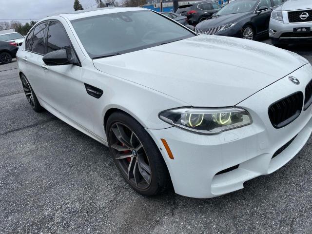 BMW M5 2014 with VIN WBSFV9C50ED097667 - Photo from auction