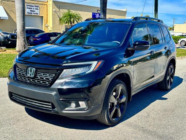 Photo 2 from auction – 2021 HONDA PASSPORT E with VIN 5FNYF8H01MB013559