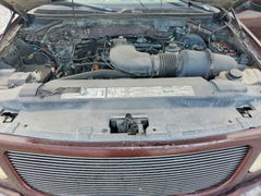 Photo 11 from auction – 2000 FORD F-150 with VIN 2FTRX08LXYCA55674