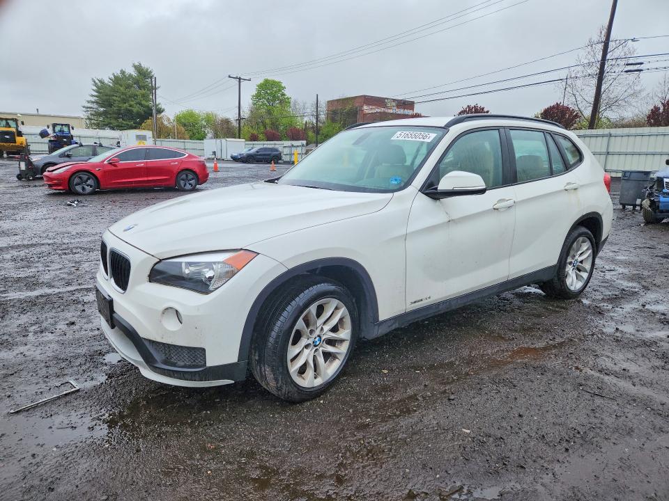 BMW X1 2015 with VIN WBAVL1C59FVY36800 - Photo from auction
