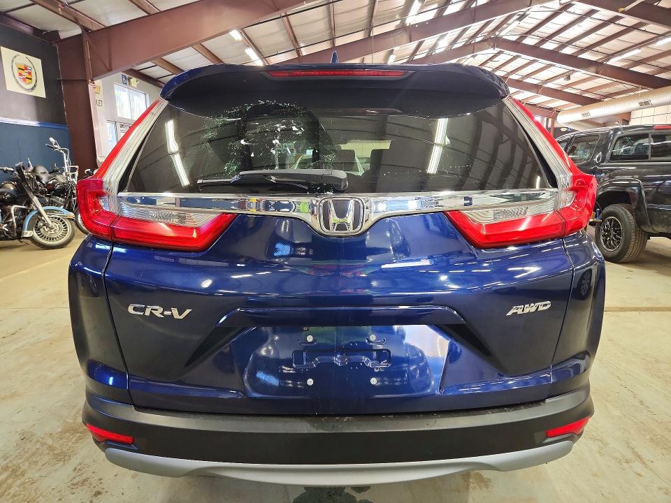 Photo 6 from auction – 2018 HONDA CR-V with VIN 7FARW2H54JE016842