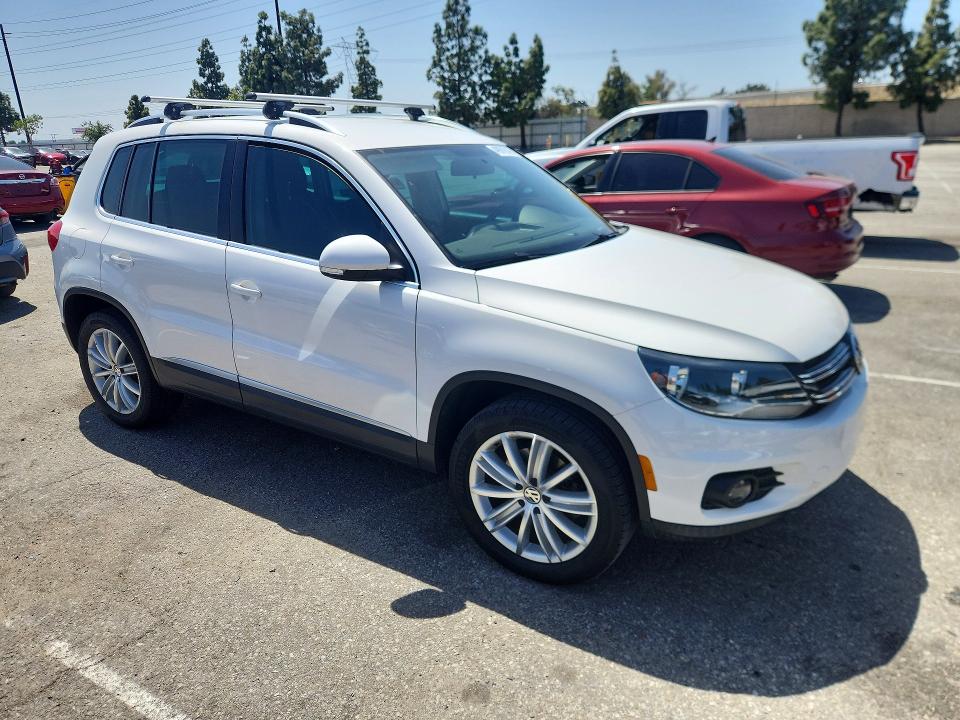 Снимка 4 от търг – 2014 VOLKSWAGEN TIGUAN с VIN WVGAV3AX4EW550496
