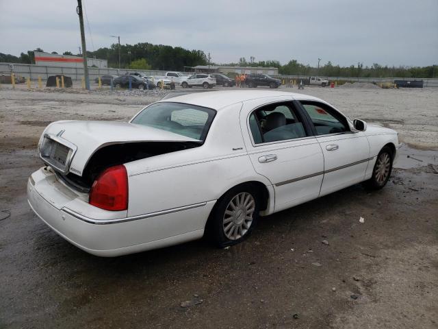 Photo 3 from auction – 2004 LINCOLN TOWN CAR E with VIN 1LNHM81W44Y629949