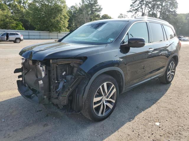 HONDA PILOT TOUR 2016 with VIN 5FNYF5H98GB051100 - Photo from auction