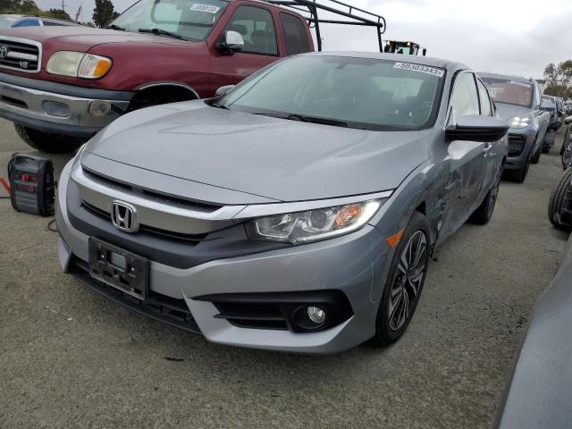 HONDA CIVIC EXL 2018 with VIN JHMFC1F70JX044261 - Photo from auction