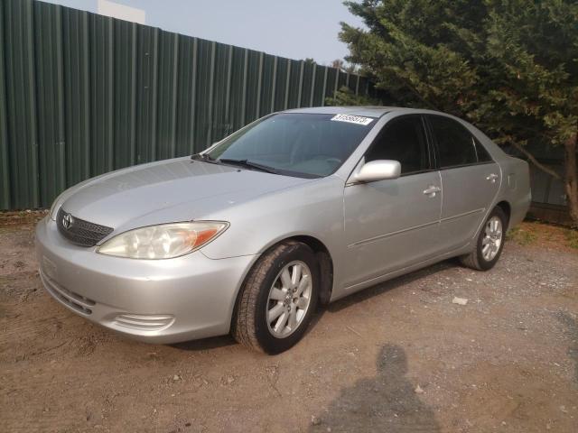 TOYOTA CAMRY LE 2002 with VIN 4T1BF30K52U520454 - Photo from auction