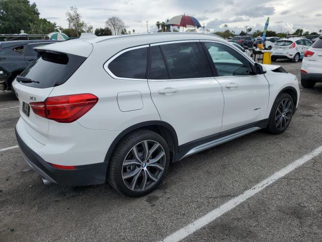 Photo 3 from auction – 2017 BMW X1 XDRIVE2 with VIN WBXHT3C30H5F78539
