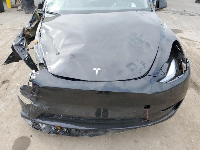 Photo 12 from auction – 2023 TESLA MODEL Y with VIN 7SAYGAEE9PF697966