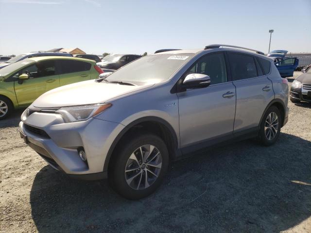TOYOTA RAV4 HV LE 2018 with VIN JTMRJREVXJD237828 - Photo from auction