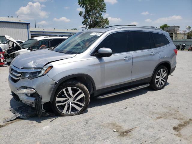 HONDA PILOT TOUR 2018 with VIN 5FNYF6H94JB023355 - Photo from auction