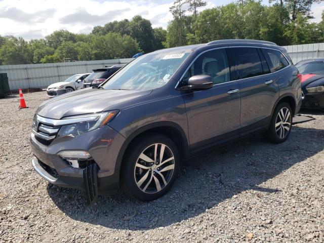 HONDA PILOT TOUR 2016 with VIN 5FNYF5H95GB032925 - Photo from auction