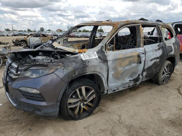 HONDA PILOT TOUR 2017 with VIN 5FNYF6H95HB019812 - Photo from auction