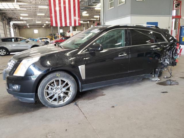CADILLAC SRX PERFOR 2013 with VIN 3GYFNDE36DS570907 - Photo from auction