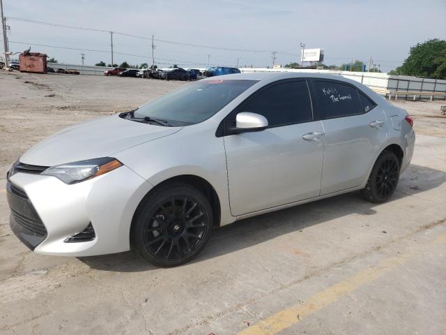 TOYOTA COROLLA L 2019 with VIN 5YFBURHE0KP877565 - Photo from auction