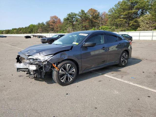 HONDA CIVIC EXL 2018 with VIN JHMFC1F77JX042457 - Photo from auction