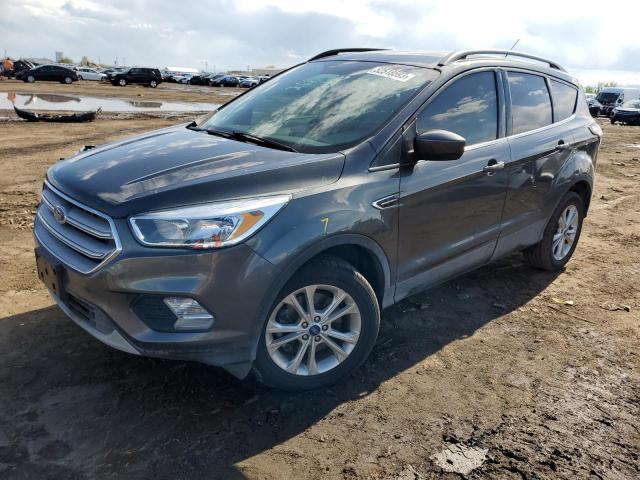 FORD ESCAPE SE 2018 with VIN 1FMCU9GD7JUC58634 - Photo from auction