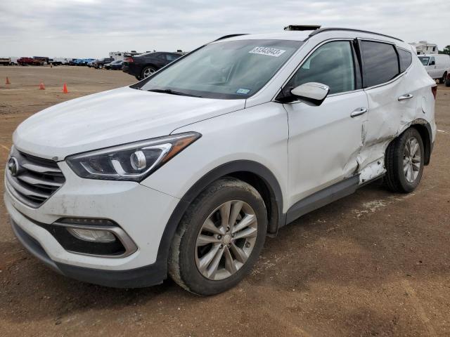HYUNDAI SANTA FE 2018 with VIN 5NMZU4LA8JH061699 - Photo from auction