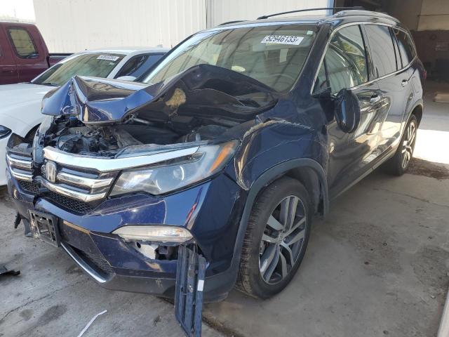 HONDA PILOT TOUR 2017 with VIN 5FNYF5H95HB034207 - Photo from auction