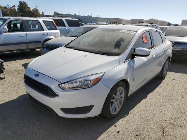 FORD FOCUS SE 2018 with VIN 1FADP3F22JL236677 - Photo from auction