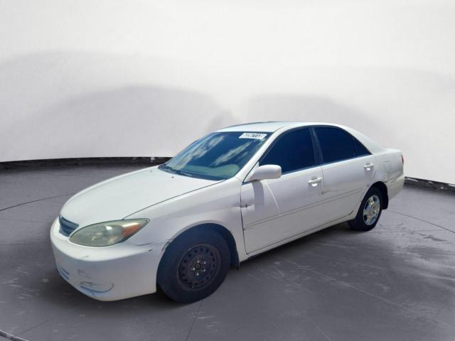 TOYOTA CAMRY LE 2002 with VIN JTDBE32K520045299 - Photo from auction