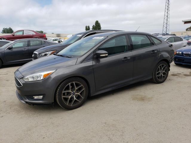 FORD FOCUS SE 2015 with VIN 1FADP3F28FL358581 - Photo from auction