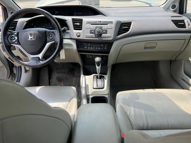 Photo 9 from auction – 2012 HONDA CIVIC HYBR with VIN JHMFB4F31CS004353