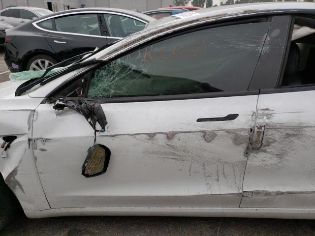 Photo 7 from auction – 2021 TESLA MODEL 3 with VIN 5YJ3E1EA3MF977890