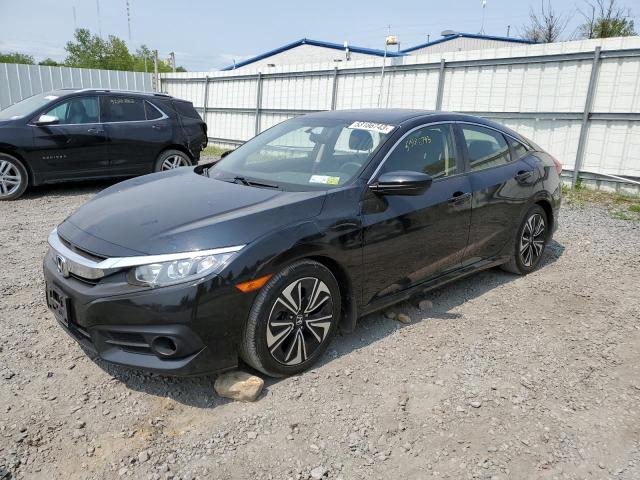 HONDA CIVIC EX 2018 with VIN JHMFC1F35JX000723 - Photo from auction