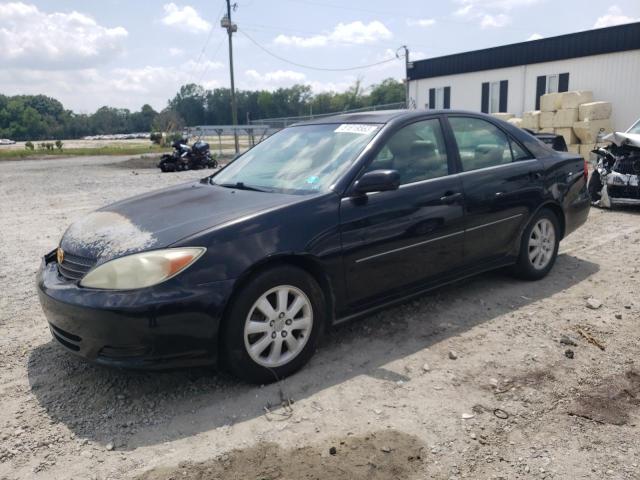 TOYOTA CAMRY LE 2002 with VIN 4T1BF30K82U025200 - Photo from auction