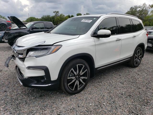 HONDA PILOT TOUR 2020 with VIN 5FNYF5H90LB022362 - Photo from auction