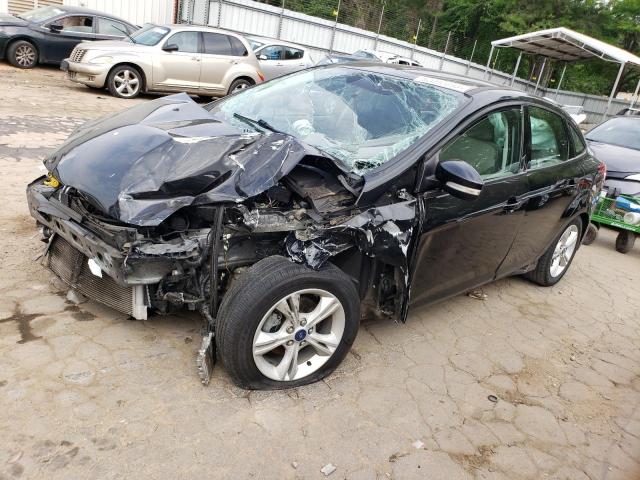 FORD FOCUS SE 2014 with VIN 1FADP3F24EL409671 - Photo from auction