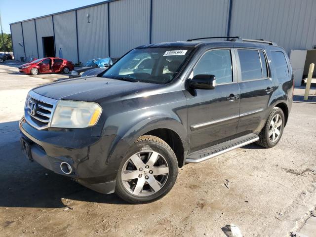 HONDA PILOT TOUR 2013 with VIN 5FNYF3H92DB037659 - Photo from auction