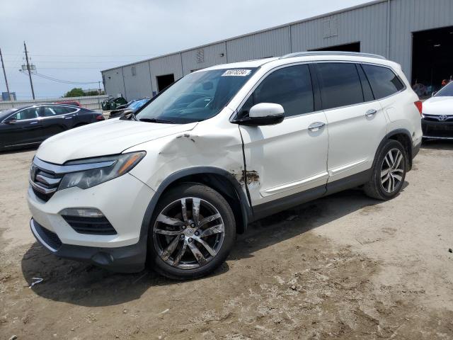 HONDA PILOT TOUR 2016 with VIN 5FNYF5H9XGB028787 - Photo from auction