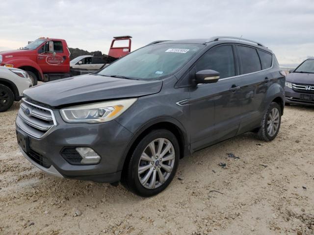 FORD ESCAPE TIT 2017 with VIN 1FMCU0J97HUC24493 - Photo from auction