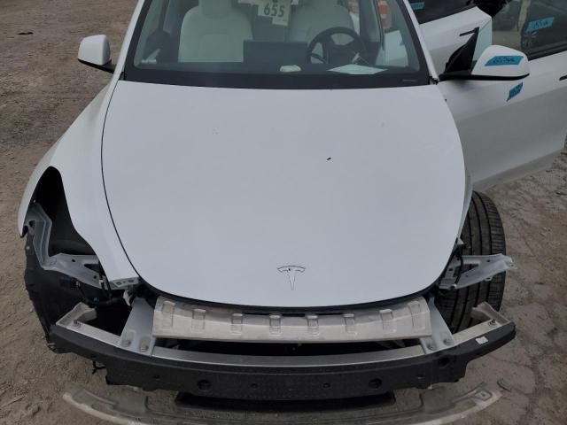 Photo 11 from auction – 2023 TESLA MODEL Y with VIN 7SAYGDEE6PA197911