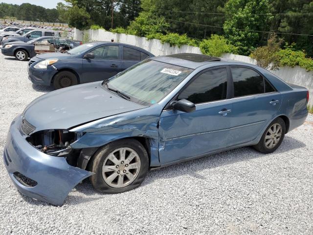 TOYOTA CAMRY LE 2003 with VIN 4T1BF32K63U550903 - Photo from auction