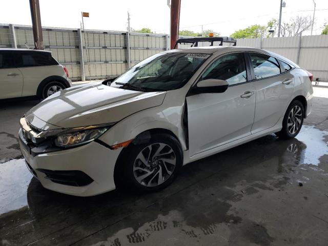 HONDA CIVIC EX 2018 with VIN 19XFC2F77JE209858 - Photo from auction