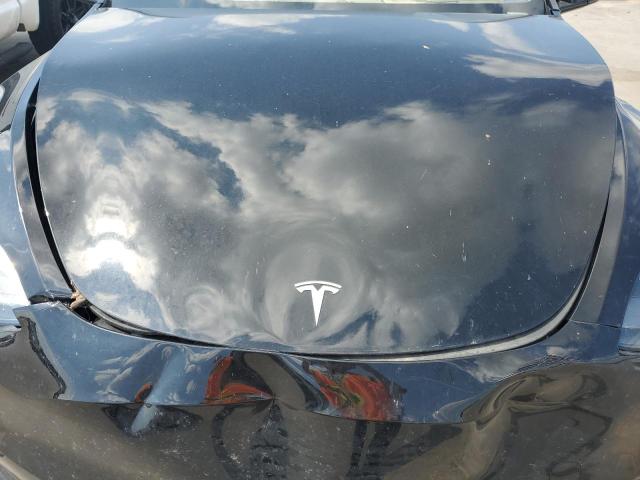 Photo 11 from auction – 2023 TESLA MODEL Y with VIN 7SAYGDEE2PA183925