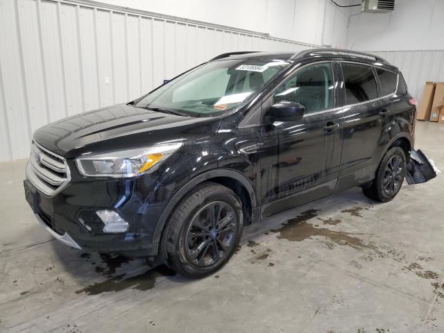 FORD ESCAPE SE 2018 with VIN 1FMCU9GD1JUD11618 - Photo from auction