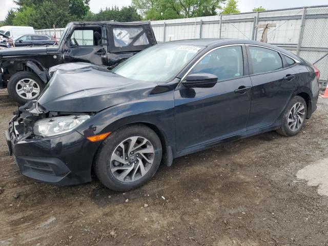 HONDA CIVIC EX 2018 with VIN 2HGFC2F77JH606279 - Photo from auction
