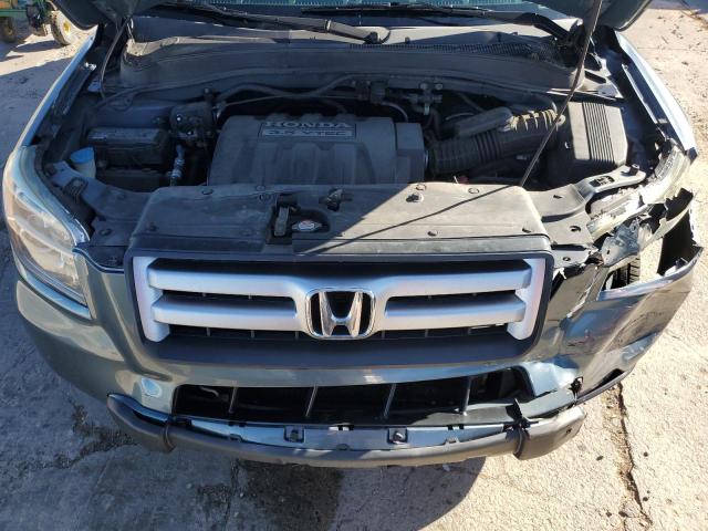 Photo 12 from auction – 2006 HONDA PILOT EX with VIN 2HKYF18716H556502
